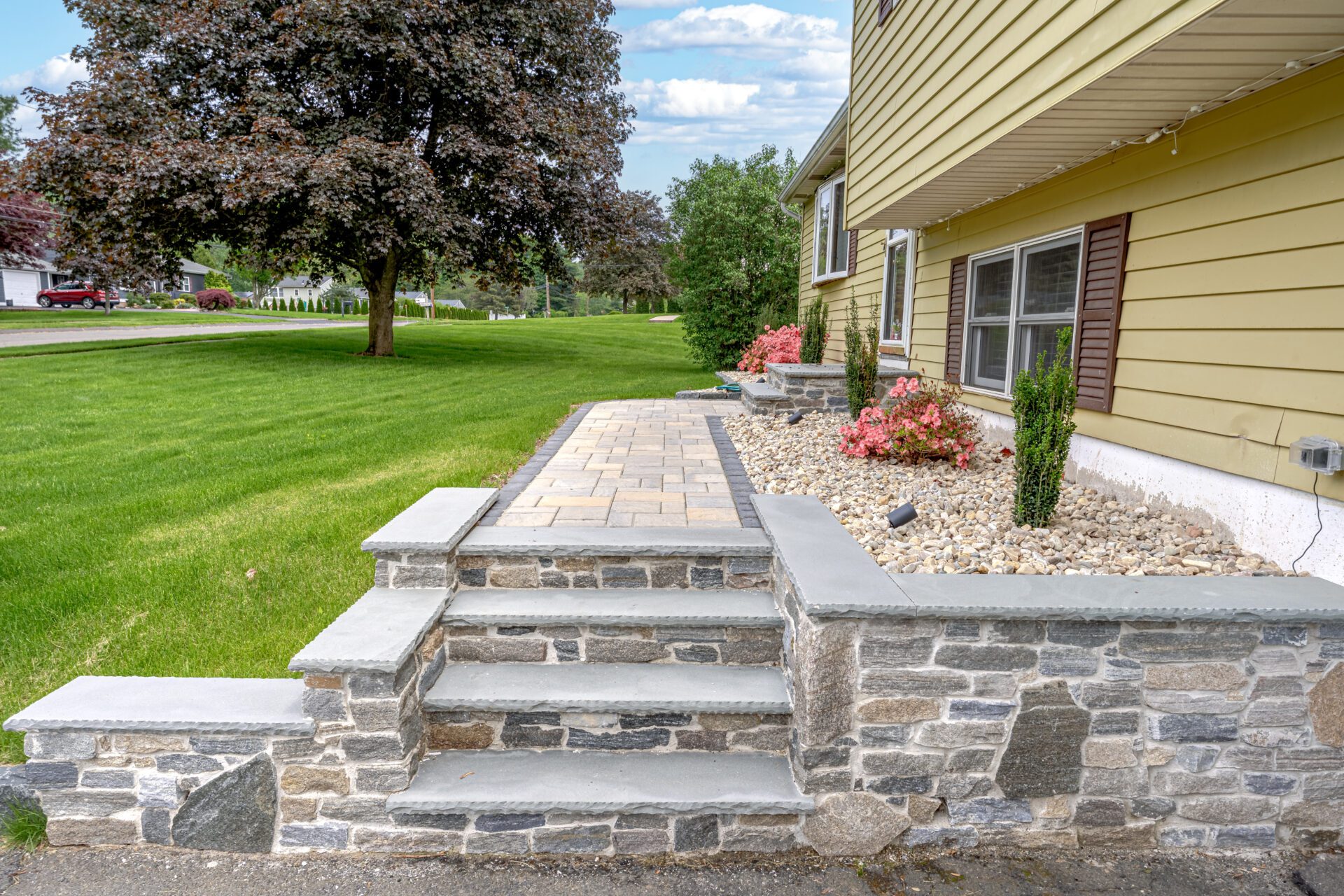 229 Malcein Dr. Southington_DSC01167-HDR-Edit Stone walkway and shrub planting along front foundation of a Southington, CT home designed and installed by HQ Landscaping